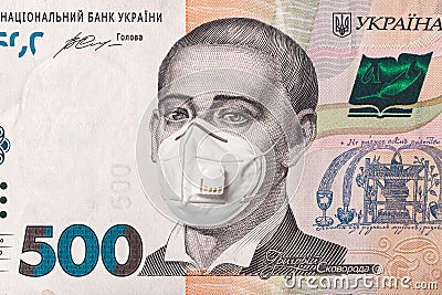 Banknote of 500 hryvnia depicting Gregory Skovoroda in a medical mask during the economic crisis and pandemic of the coronavirus. Stock Photo