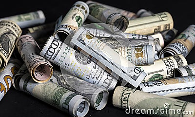 Banknotes of american dollar bills of various denominations on a dark background Stock Photo