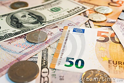 Banknotes of different currencies. Coins and cash, currency exchange. Travelling and tourism Stock Photo