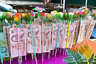 Banknotes donated by visitors for maintenance the temple Editorial Stock Photo