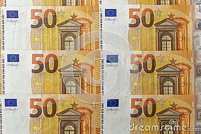 Banknotes 50 euros beautifully laid out. Euro notes background on a long banner. Beautiful original cash flow Stock Photo