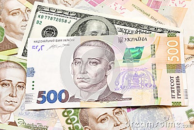 Banknotes of hryvnia, dollars, euro close-up lie on the table. B Stock Photo