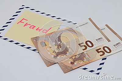 Banknotes in a postal envelope. Fraud concept. Financial fraud. Close-up. Sticker labeled scam. Stock Photo