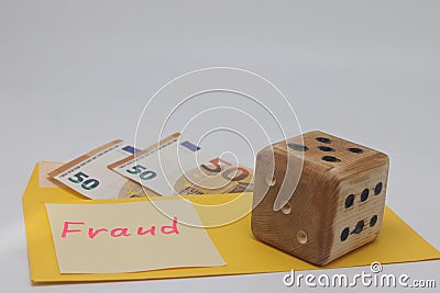 Banknotes in a yellow envelope. Fraud concept. Financial fraud. Dice. Sticker labeled scam, fraudm. Stock Photo