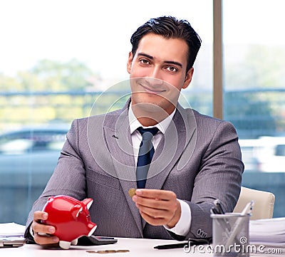 The bankrupt broke businessman with piggy bank Stock Photo