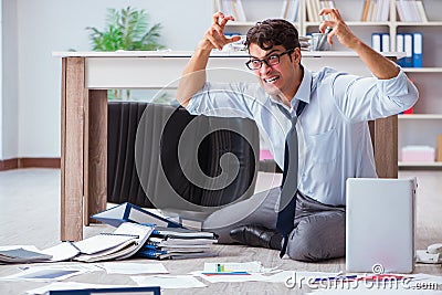 The bankrupt businessman angry in the office floor Stock Photo