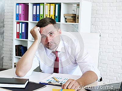 Bankruptcy and business problems. Portrait of a tired businessman. Stock Photo