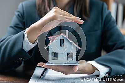 Banks approve loans to buy homes. Real estate agents explain the document for customers who come to contact to buy a house, buy or Stock Photo