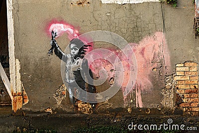 Banksy graffiti in Venice Italy - Child with life jacket and signal rocket Editorial Stock Photo