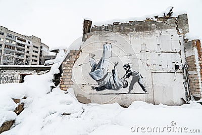 Banksy graffiti on a wall in Borodyanka, Ukraine Editorial Stock Photo