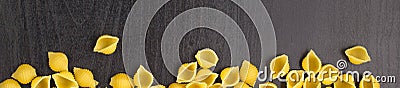 banner of Border of A pile of conchiglie paste shells on black background with copyspace Stock Photo