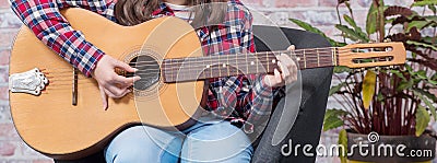 Banner close up of hands teenager girl playing guitar Stock Photo
