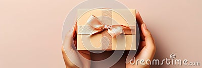 Banner with gift box in woman hands. Concept Happy Mother& x27;s Day or Happy women& x27;s day, Valentine& x27;s day Stock Photo