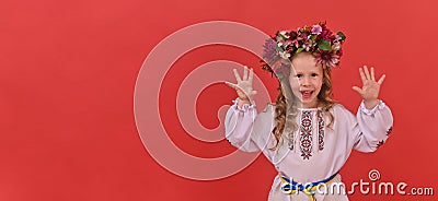 banner girl in Ukrainian embroidery on a red background. copy space Stock Photo
