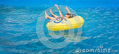 Banner with happy teenager boy in amusement park Stock Photo