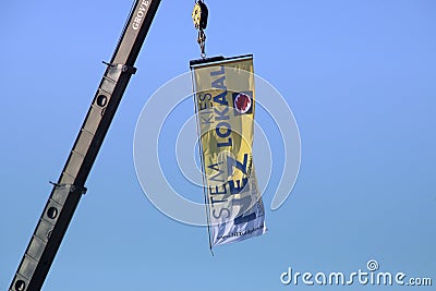 Banner of the local party NEZ in Zuidplas hanging on a crane Editorial Stock Photo