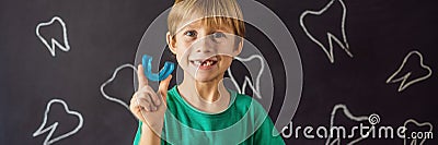 BANNER, LONG FORMAT Six-year old boy shows myofunctional trainer. Helps equalize the growing teeth and correct bite Stock Photo