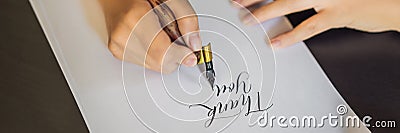 BANNER, LONG FORMAT Thank you. Calligrapher Young Woman writes phrase on white paper. Inscribing ornamental decorated Stock Photo