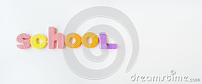 Banner with multi-colored letters. Letters for the study of children in kindergarten or school, fluted letters. School inscription Stock Photo