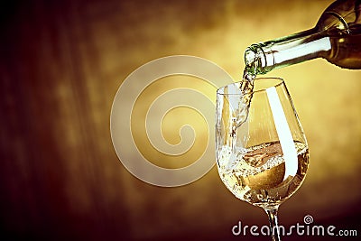 Banner ofPouring a glass of white wine from a bottle Stock Photo