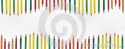 Banner of pencils different colors fro red to green o the top and bottom flat lay top view on white background with copy space. Stock Photo