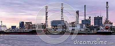 Banner of petroleum oil refinery plant beside river in twilight time Stock Photo