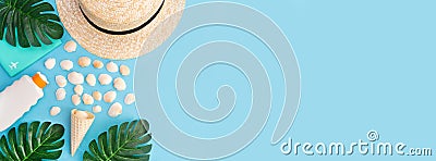 Banner for a summer vacation with shells, palm leaves and a straw hat. Blue background with copy space. Place for text. Stock Photo