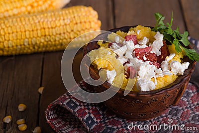 Banosh - Ukrainian Hutsul meal maize porridge with bacon cracklings and cheese Stock Photo