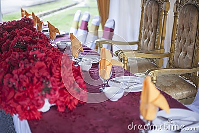 Banquet with red table setting tablecloth white dishes with shallow DOF Stock Photo