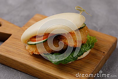 Bao buns. Hawaiian dish on a wooden table. Pan-Asian cuisine concept. Close-up Stock Photo