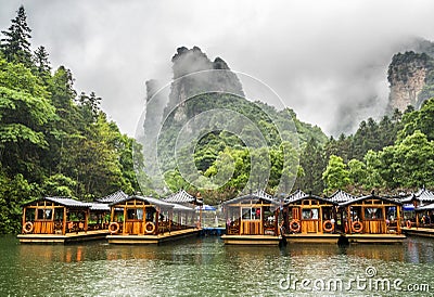 Baofeng Lake Boat Trip in a rainy day with clouds and mist at Wulingyuan, Zhangjiajie National Forest Park, Hunan Province, China, Stock Photo