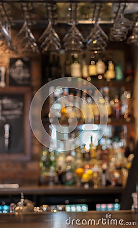 Bar counter in English pub with bokeh lights and blurry background. Stock Photo