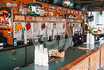 Bar Counter with Slush Machines in Flying Monkeys Saloon, Key West, Florida Editorial Stock Photo