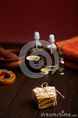 Bar of handmade soap on dark wood background. Natural cosmetic oil, cream, and natural handmade wax with lavender Stock Photo