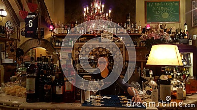 Bar in Rome, Italy with bartender Editorial Stock Photo