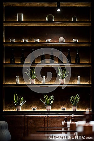 Bar shelf with bottles lightning by led lamps Stock Photo