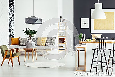 Multifunctional interior with green chair Stock Photo