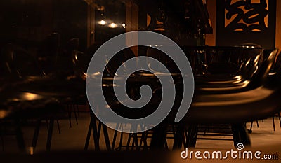 Bar stools in a dark bar Stock Photo