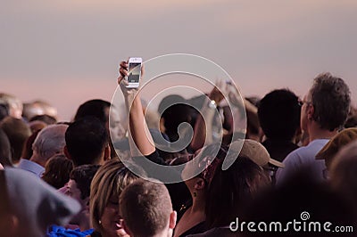 Crowd taking pictures with cell phones, event. Editorial Stock Photo