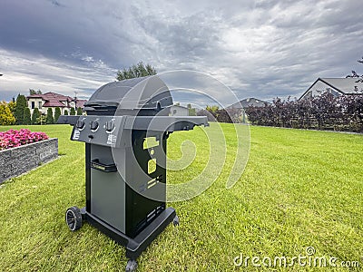 Barbecue in an elegant backyard of a modern house Editorial Stock Photo