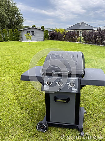 Barbecue in an elegant backyard of a modern house Editorial Stock Photo