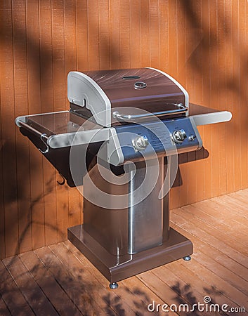Barbecue grill on cedar deck Stock Photo