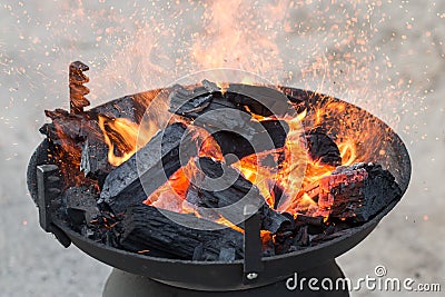 Barbecue grill, charcoal and Flames of Fire Stock Photo