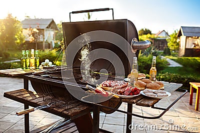 Barbecue grill party. Tasty food on wooden desk. Stock Photo