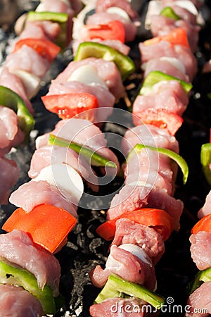 Barbecue with raw meat skewers Stock Photo