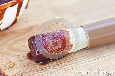 Barbecue sauce and brush. Stock Photo