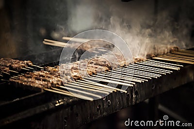 Barbecue with small skewers Stock Photo