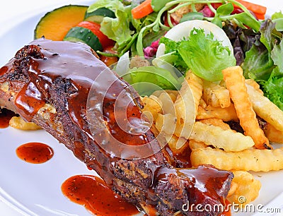 Barbecued pork ribs with French Fries Stock Photo