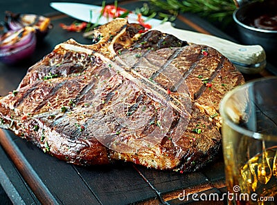 Barbecued t-bone steak seasoned with herbs Stock Photo