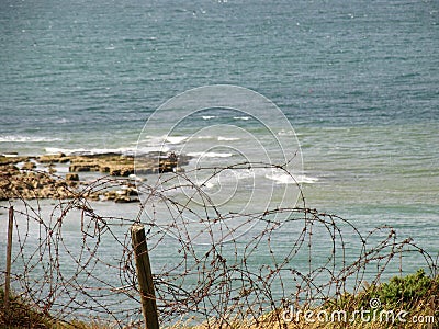 Barbed Wire on the Cliff of Pointe Du Hoc Stock Photo